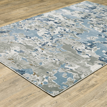 5' X 8' Grey Blue Ivory Navy Beige And Brown Abstract Power Loom Stain Resistant Area Rug