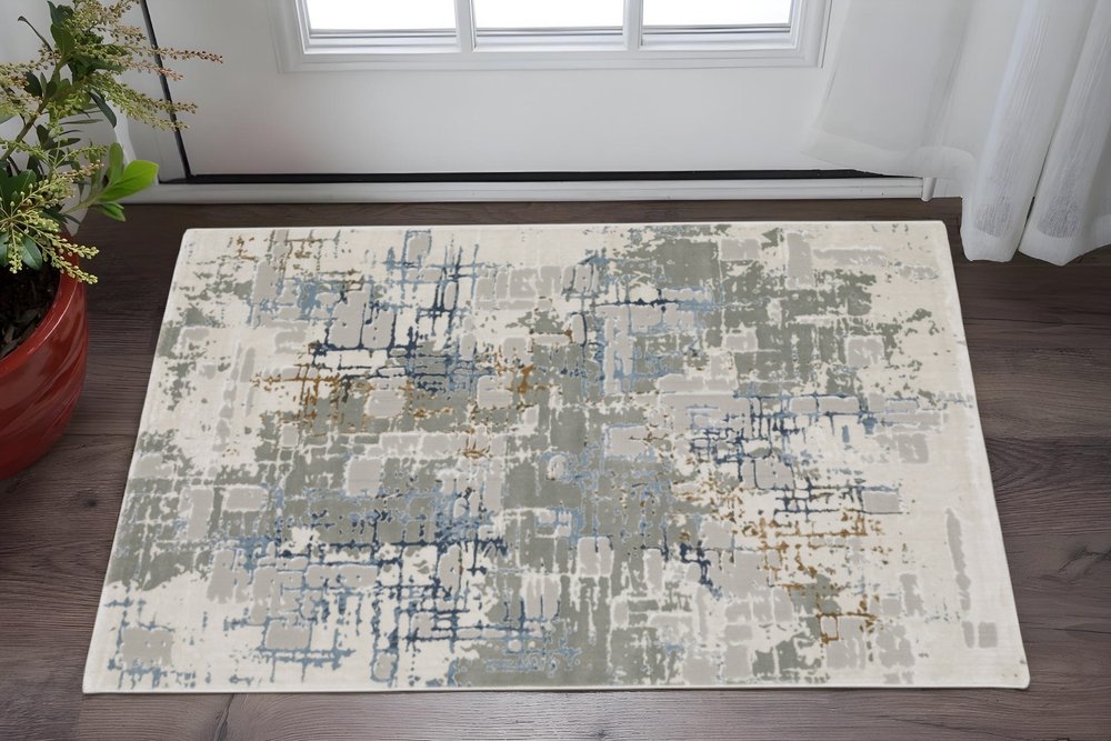 3' X 5' Grey Blue Brown Ivory And Deep Blue Abstract Power Loom Stain Resistant Area Rug
