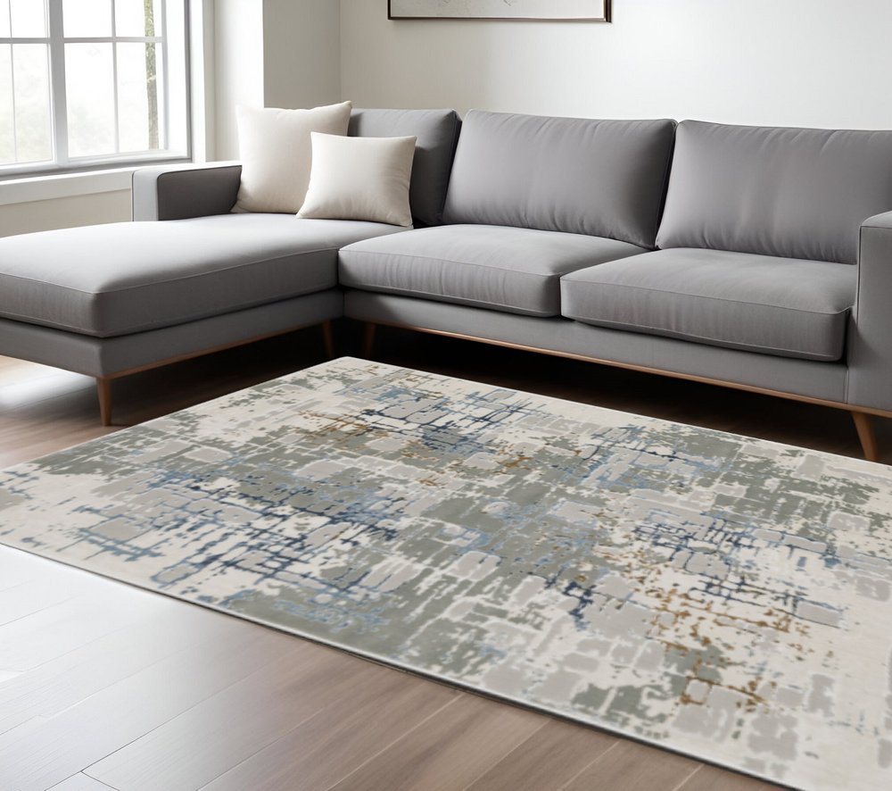 6' X 9' Grey Blue Brown Ivory And Deep Blue Abstract Power Loom Stain Resistant Area Rug