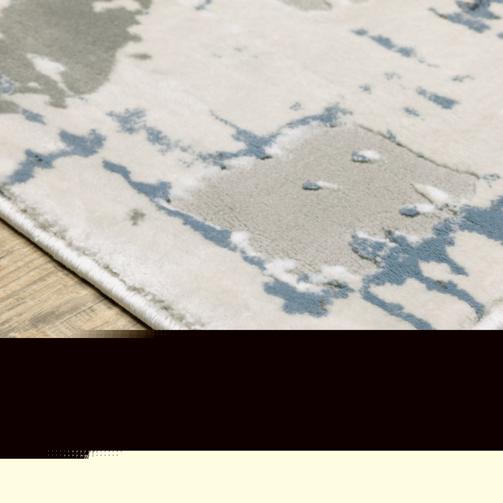 6' X 9' Grey Blue Brown Ivory And Deep Blue Abstract Power Loom Stain Resistant Area Rug