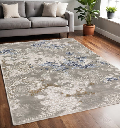5' X 8' Grey Blue Ivory Brown And Navy Abstract Power Loom Stain Resistant Area Rug