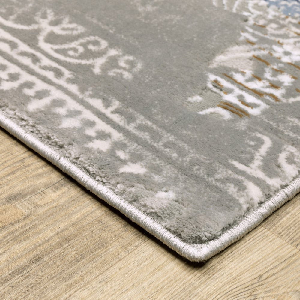 5' X 8' Grey Blue Ivory Brown And Navy Abstract Power Loom Stain Resistant Area Rug