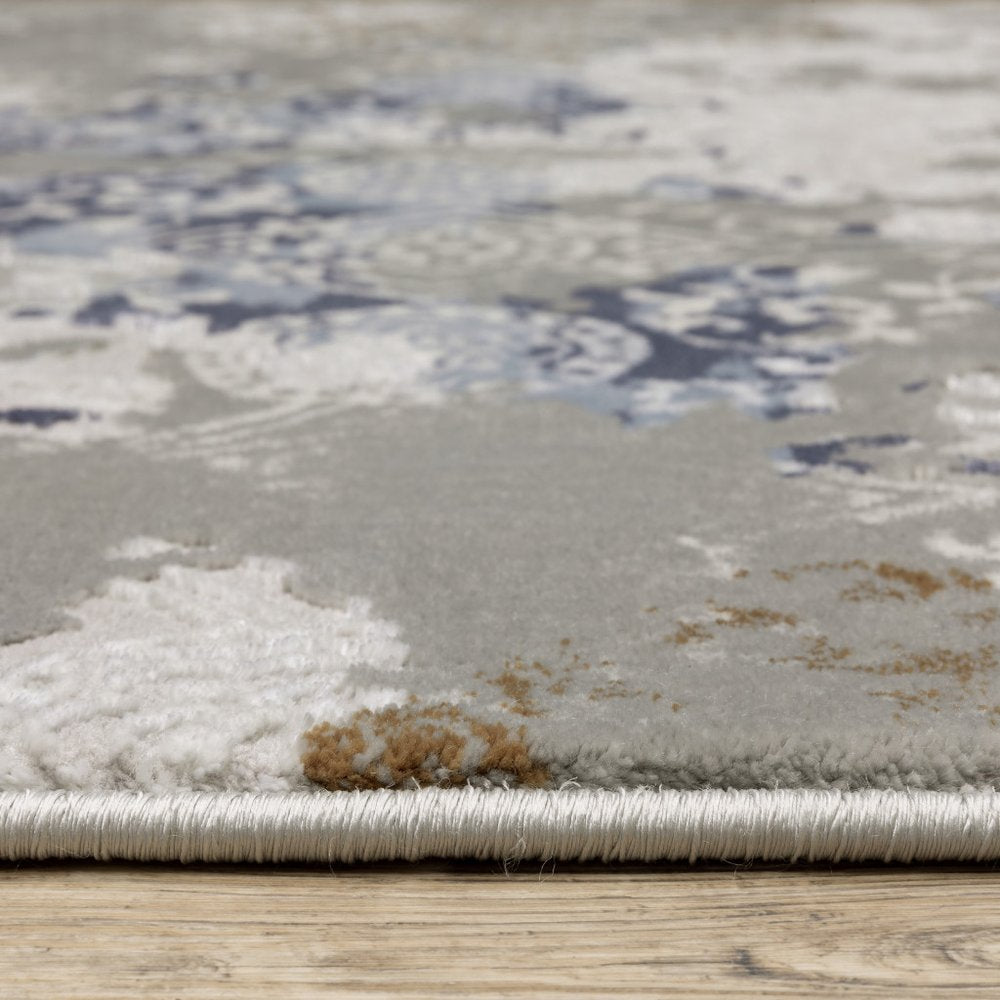 5' X 8' Grey Blue Ivory Brown And Navy Abstract Power Loom Stain Resistant Area Rug