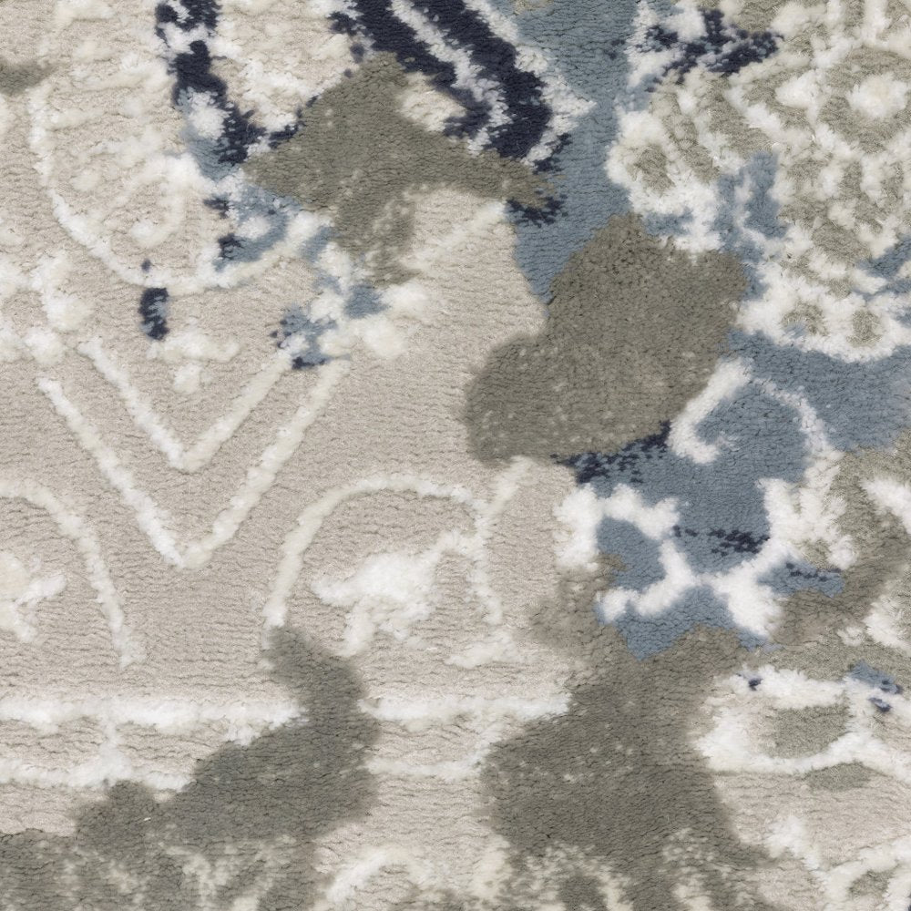 5' X 8' Grey Blue Ivory Brown And Navy Abstract Power Loom Stain Resistant Area Rug