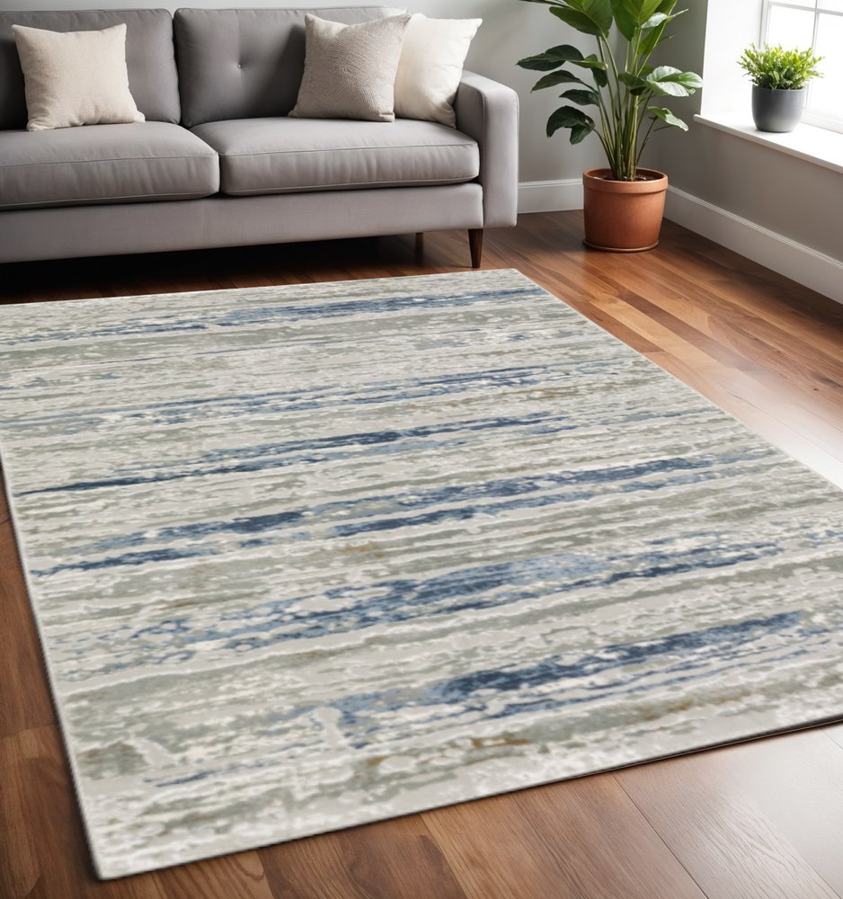 5' X 8' Blue Ivory Grey Light Blue And Brown Abstract Power Loom Stain Resistant Area Rug