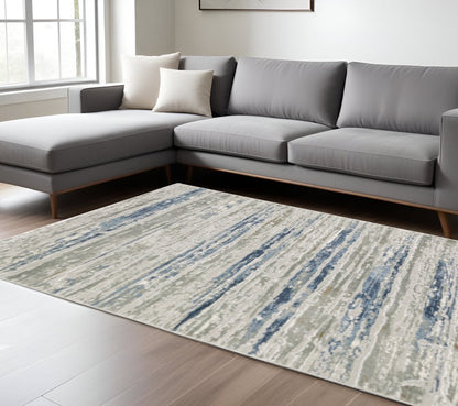 6' X 9' Blue Ivory Grey Light Blue And Brown Abstract Power Loom Stain Resistant Area Rug