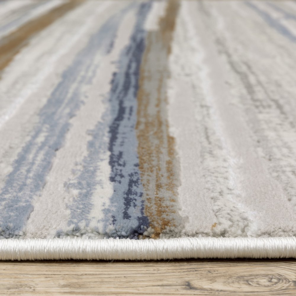 3' X 5' Grey Blue Ivory Brown Beige And Navy Abstract Power Loom Stain Resistant Area Rug