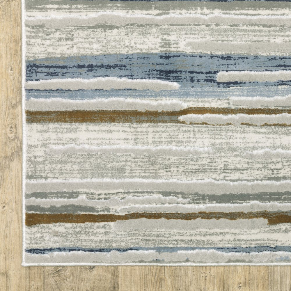 3' X 5' Grey Blue Ivory Brown Beige And Navy Abstract Power Loom Stain Resistant Area Rug