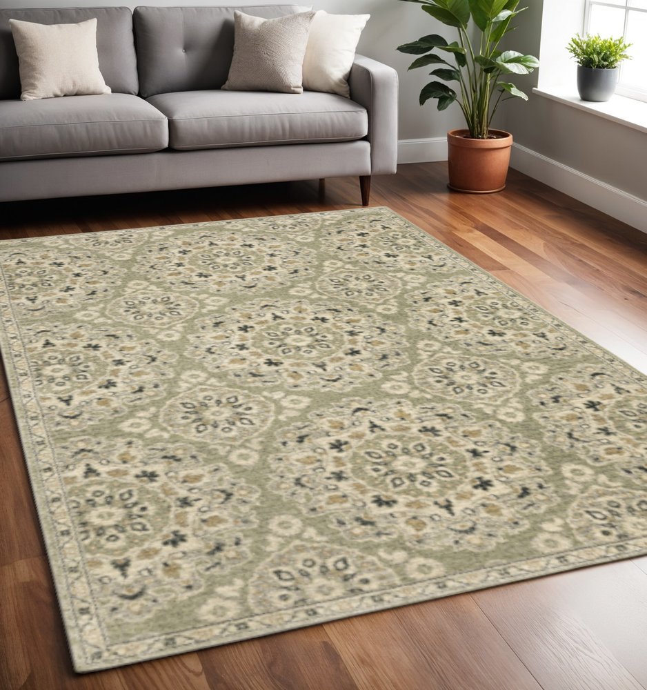 5' X 8' Green Ivory Grey And Tan Floral Power Loom Stain Resistant Area Rug