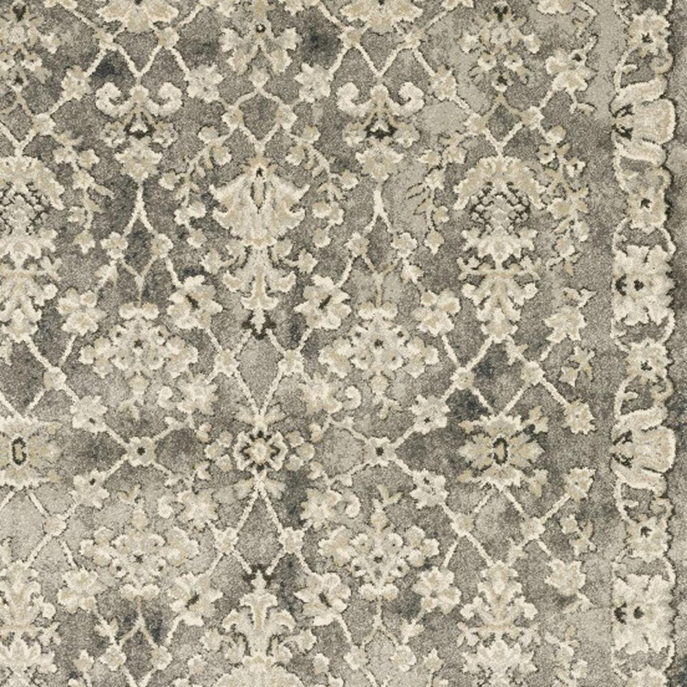6' X 9' Grey Beige Tan And Brown Oriental Power Loom Stain Resistant Area Rug