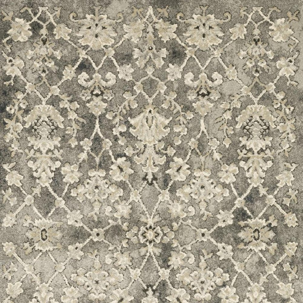 6' X 9' Grey Beige Tan And Brown Oriental Power Loom Stain Resistant Area Rug