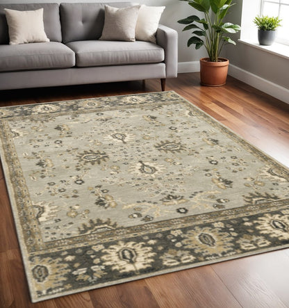 5' X 8' Grey Brown Tan And Beige Oriental Power Loom Stain Resistant Area Rug