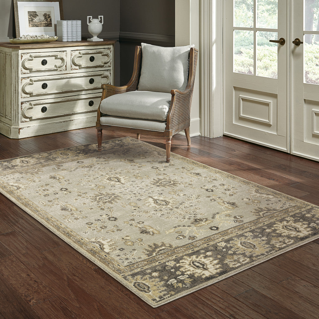 5' X 8' Grey Brown Tan And Beige Oriental Power Loom Stain Resistant Area Rug