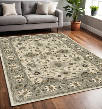 5' X 8' Beige Grey Brown And Charcoal Oriental Power Loom Stain Resistant Area Rug