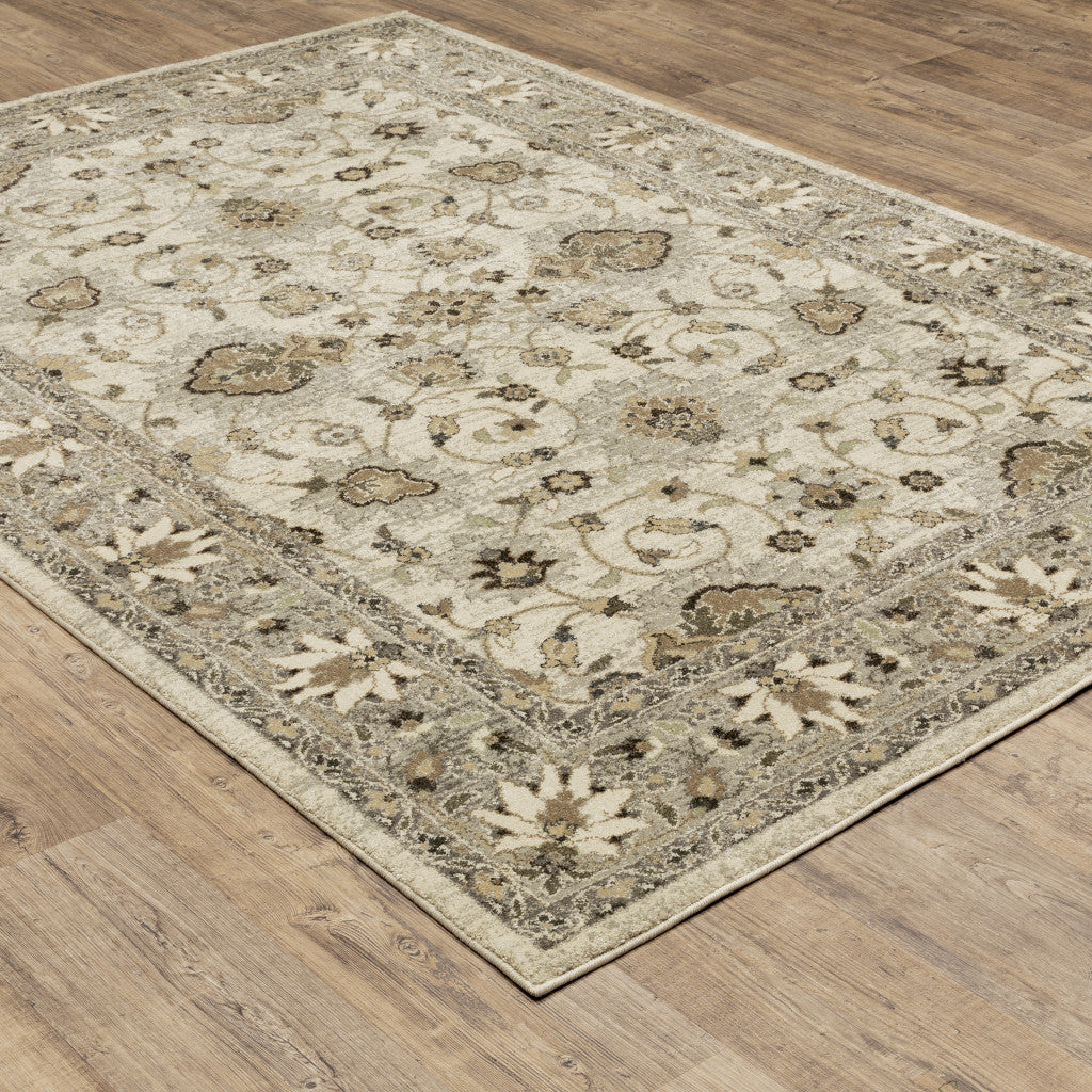 5' X 8' Beige Grey Brown And Charcoal Oriental Power Loom Stain Resistant Area Rug