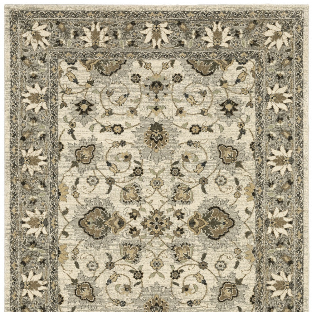 6' X 9' Beige Grey Brown And Charcoal Oriental Power Loom Stain Resistant Area Rug