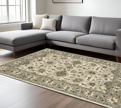 6' X 9' Beige Grey Brown And Charcoal Oriental Power Loom Stain Resistant Area Rug