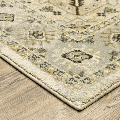 5' X 8' Beige Grey Tan And Brown Oriental Power Loom Stain Resistant Area Rug