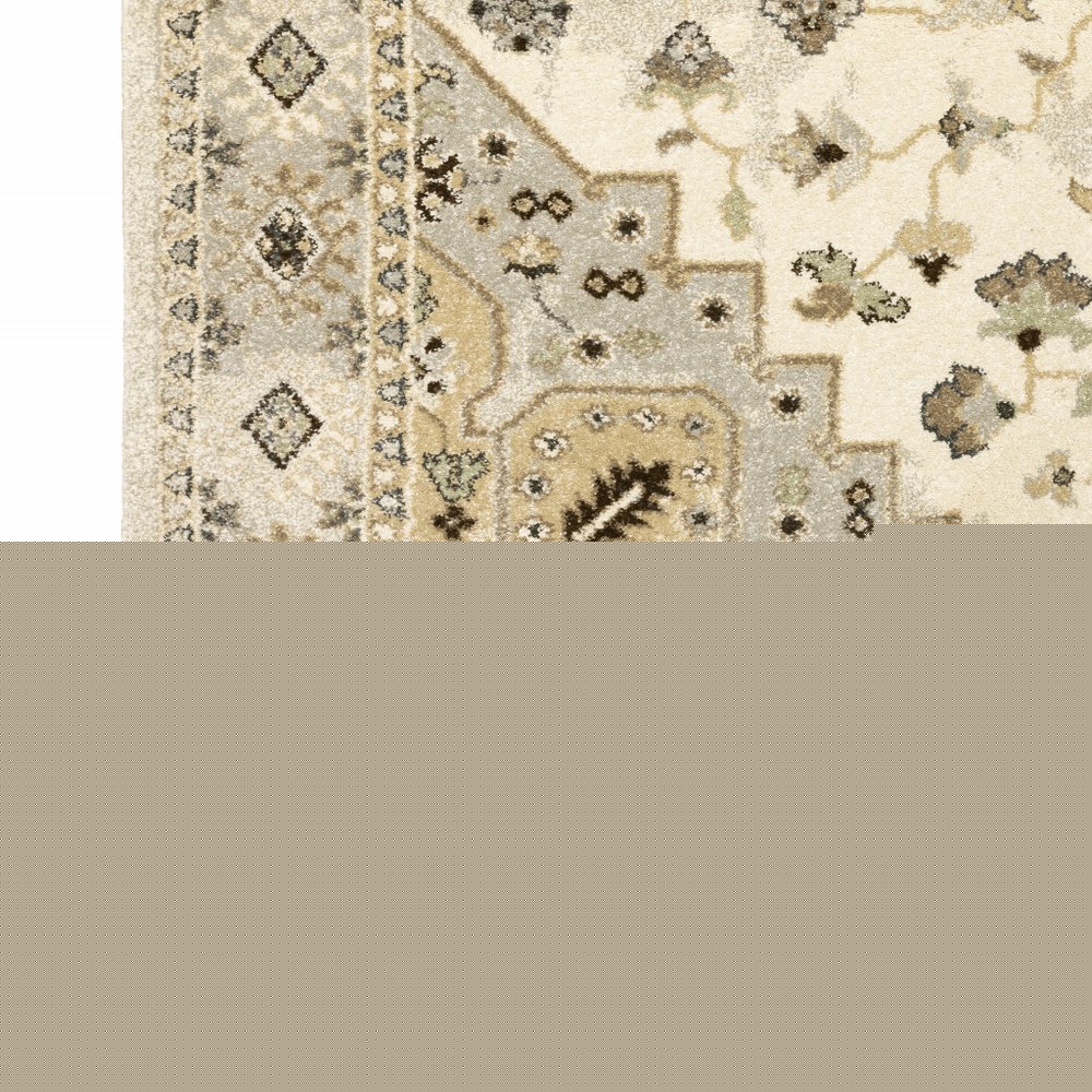 5' X 8' Beige Grey Tan And Brown Oriental Power Loom Stain Resistant Area Rug