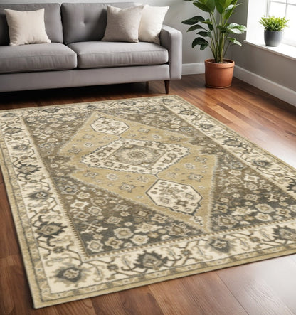 5' X 8' Beige Grey Tan And Charcoal Oriental Power Loom Stain Resistant Area Rug