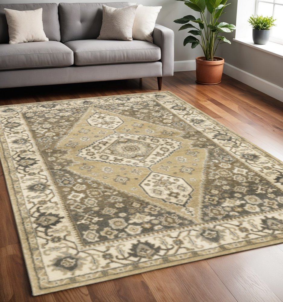 5' X 8' Beige Grey Tan And Charcoal Oriental Power Loom Stain Resistant Area Rug