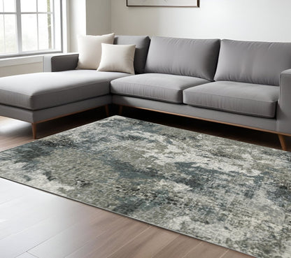 10' X 13' Ivory Grey Charcoal Blue And Navy Abstract Power Loom Stain Resistant Area Rug