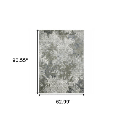 5' X 8' Ivory Grey Blue And Taupe Abstract Power Loom Stain Resistant Area Rug