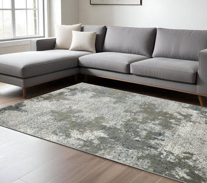 10' X 13' Ivory Grey Blue And Taupe Abstract Power Loom Stain Resistant Area Rug