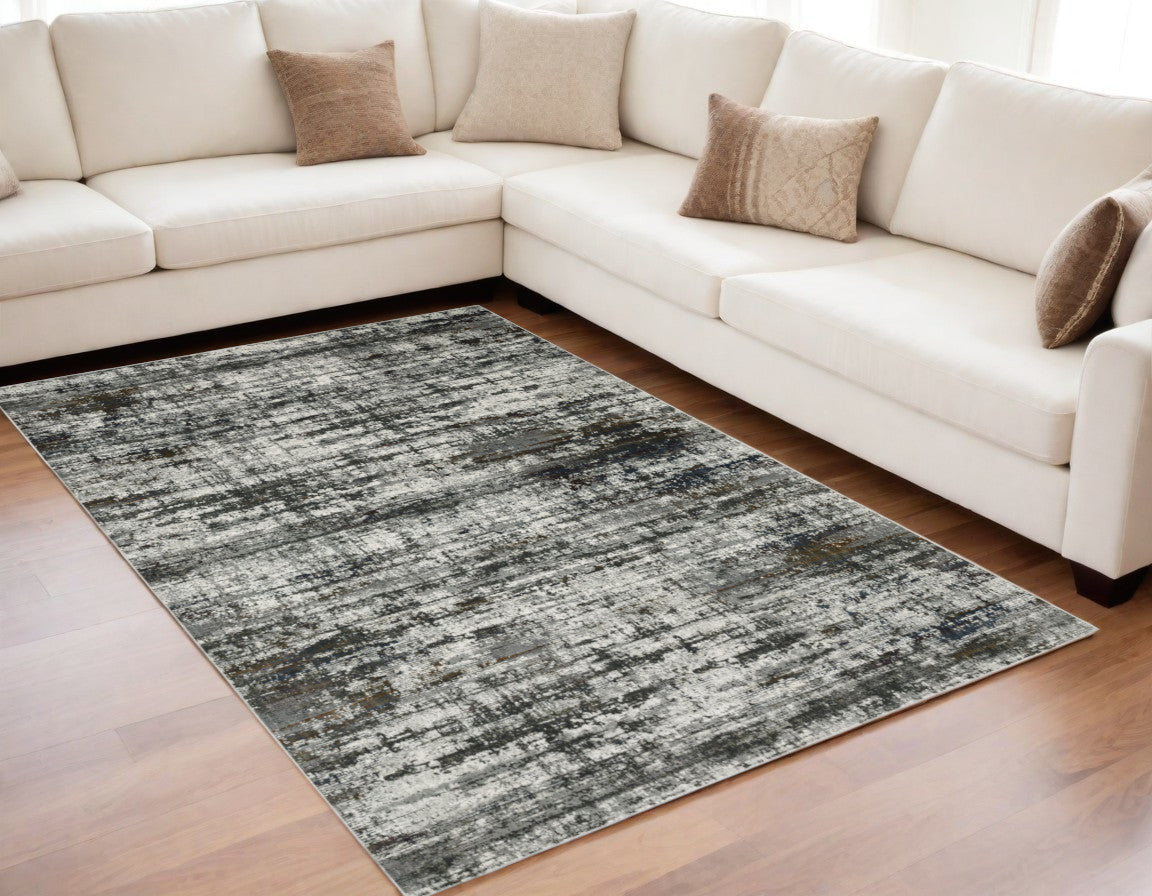 5' X 8' Ivory Charcoal Grey Blue Rust And Brown Abstract Power Loom Stain Resistant Area Rug