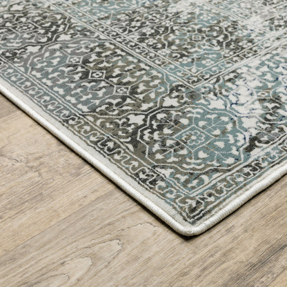 4' X 6' Ivory Grey Charcoal Blue And Rust Oriental Power Loom Stain Resistant Area Rug