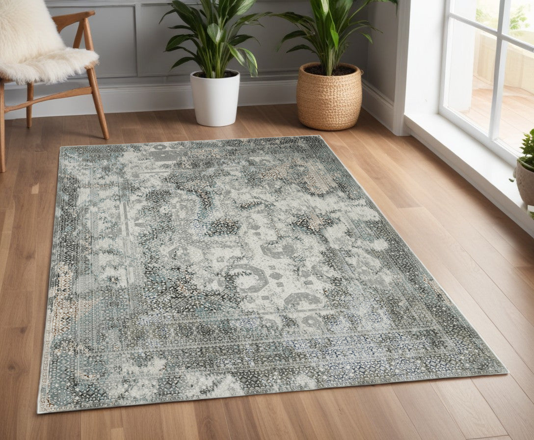 4' X 6' Ivory Grey Charcoal Blue And Rust Oriental Power Loom Stain Resistant Area Rug