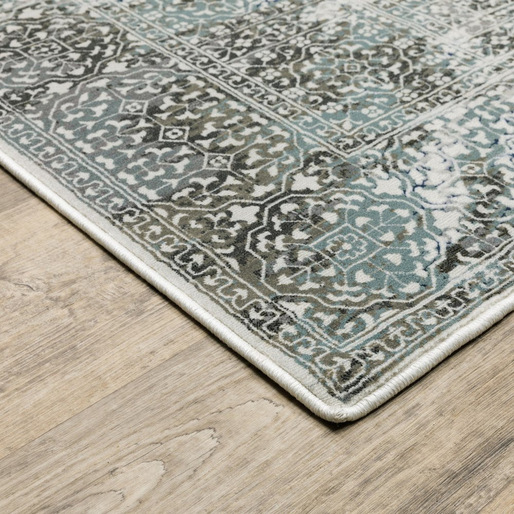 6' X 9' Ivory Grey Charcoal Blue And Rust Oriental Power Loom Stain Resistant Area Rug