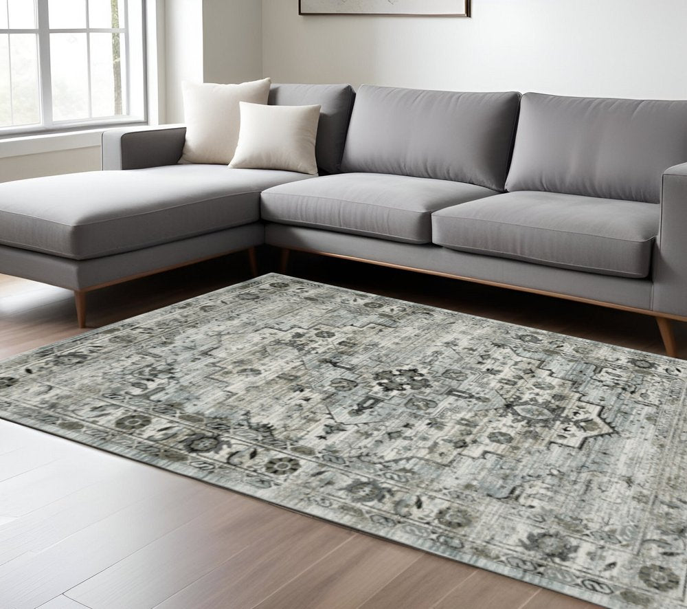 6' X 9' Ivory Grey Charcoal Blue And Taupe Oriental Power Loom Stain Resistant Area Rug