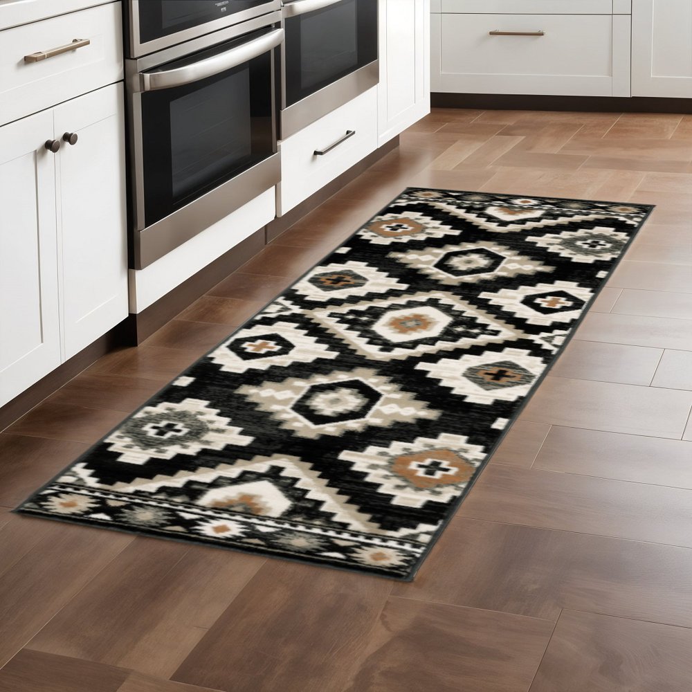 2' X 8' Black Grey Tan Orange And Ivory Southwestern Power Loom Stain Resistant Runner Rug