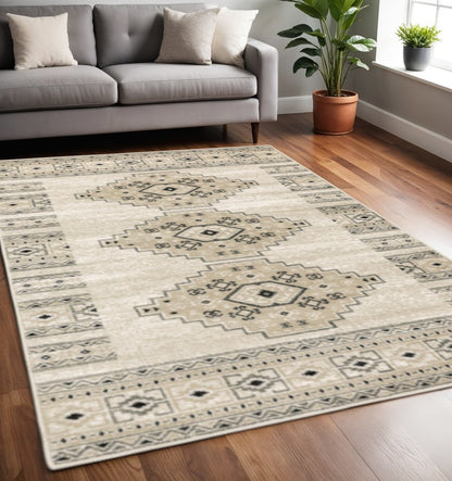 5' X 7' Ivory Grey Black And Ivory Southwestern Power Loom Stain Resistant Area Rug