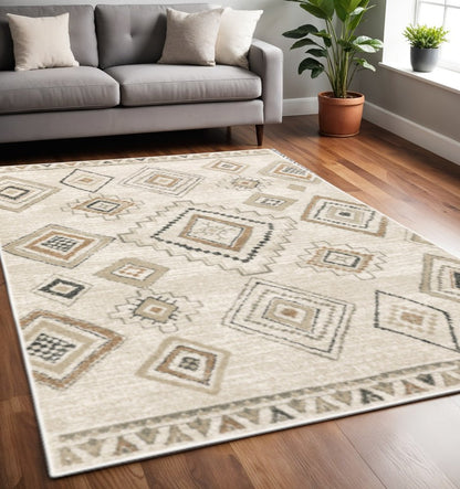 5' X 7' Ivory Orange Tan Black And Grey Southwestern Power Loom Stain Resistant Area Rug