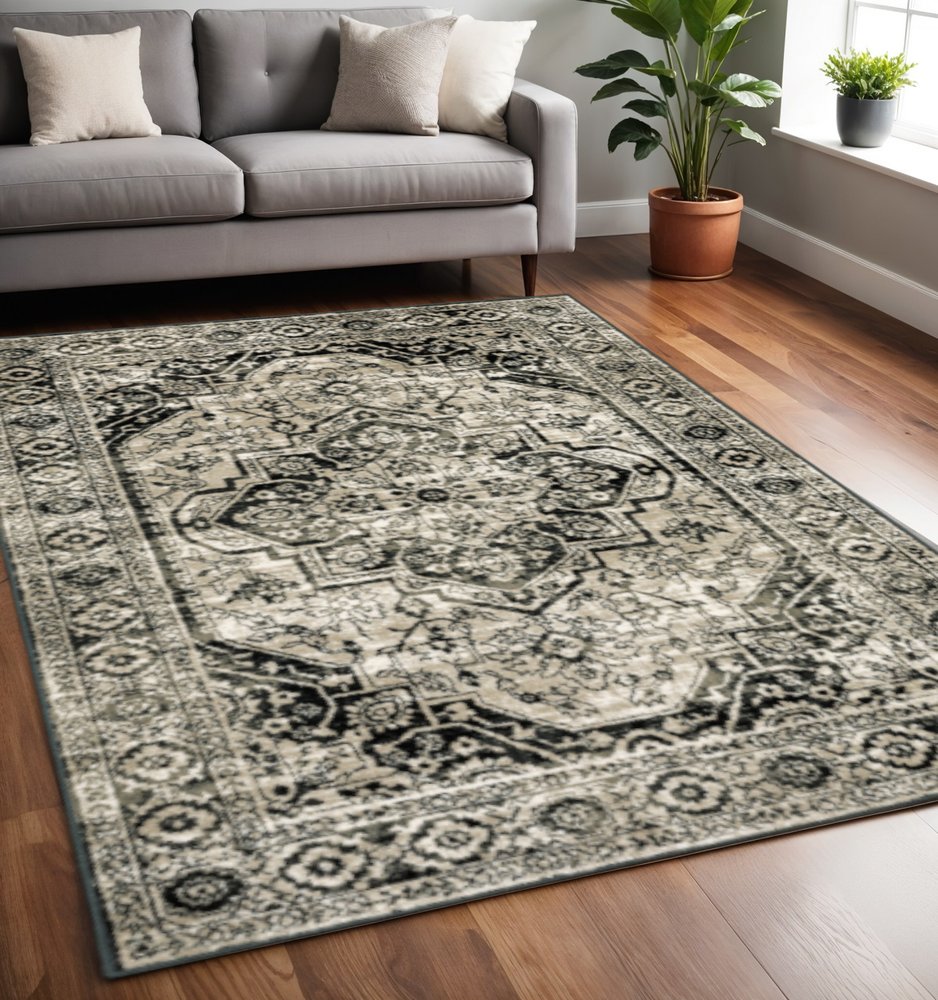 5' X 7' Black Grey Tan And Ivory Oriental Power Loom Stain Resistant Area Rug
