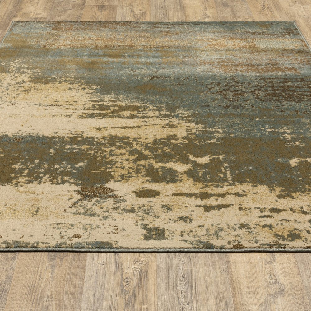 5' X 7' Teal Blue Brown Green And Beige Abstract Power Loom Stain Resistant Area Rug