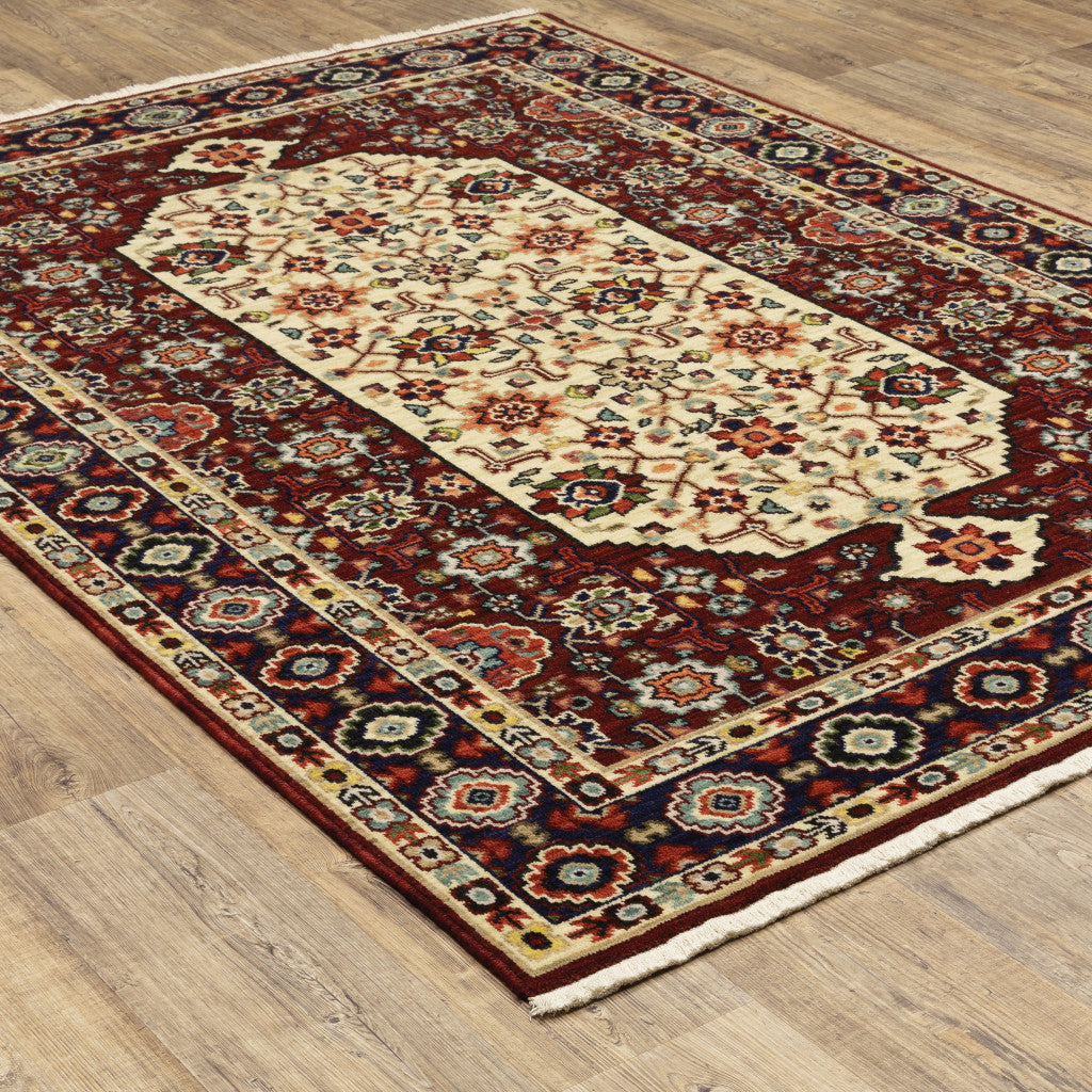 2' X 3' Red Ivory Blue And Orange Oriental Power Loom Stain Resistant Area Rug With Fringe