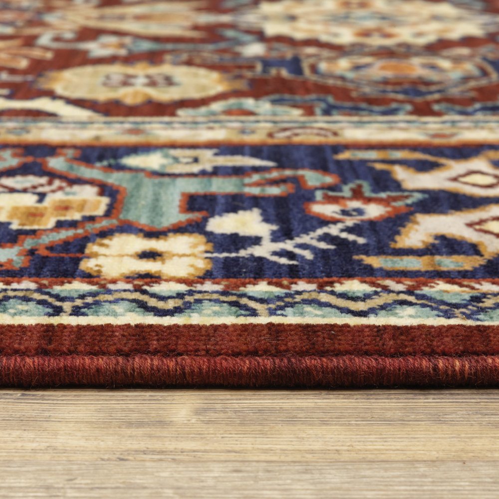 5' X 8' Red Blue Orange And Beige Oriental Power Loom Stain Resistant Area Rug With Fringe