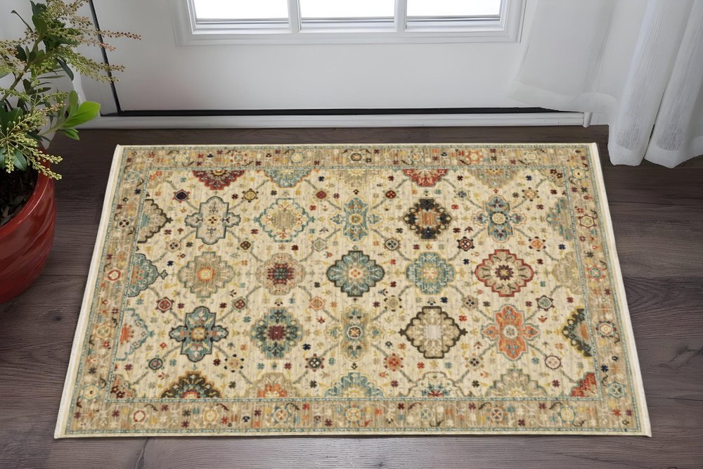3' X 5' Beige Pale Blue Rust Gold Tan Brown And Orange Oriental Power Loom Stain Resistant Area Rug With Fringe