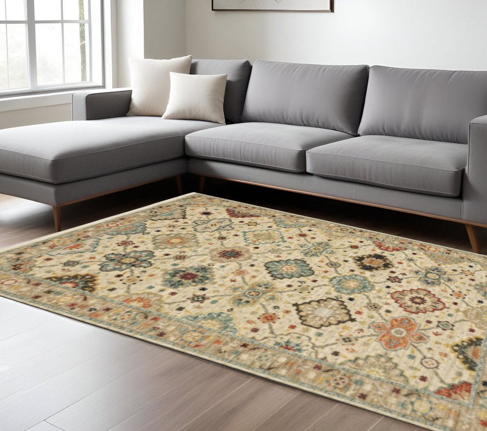 10' X 13' Beige Pale Blue Rust Gold Tan Brown And Orange Oriental Power Loom Stain Resistant Area Rug With Fringe