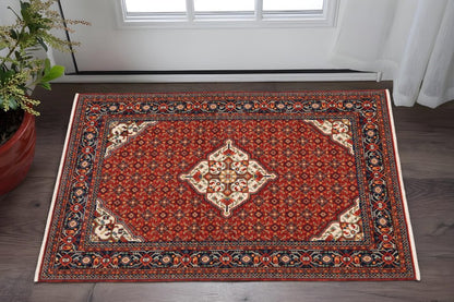 3' X 5' Red Blue Ivory And Orange Oriental Power Loom Stain Resistant Area Rug With Fringe