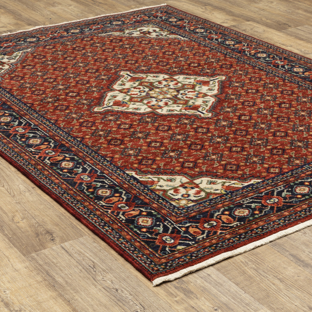 5' X 8' Red Blue Ivory And Orange Oriental Power Loom Stain Resistant Area Rug With Fringe