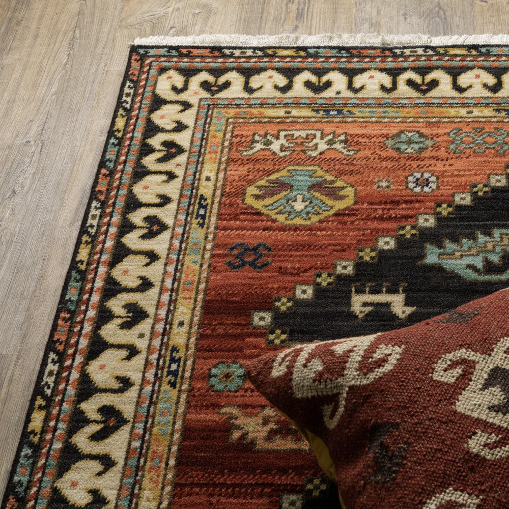 2' X 3' Charcoal Brown Orange Salmon Gold Navy Ivory And Pale Blue Oriental Power Loom Stain Resistant Area Rug With Fringe