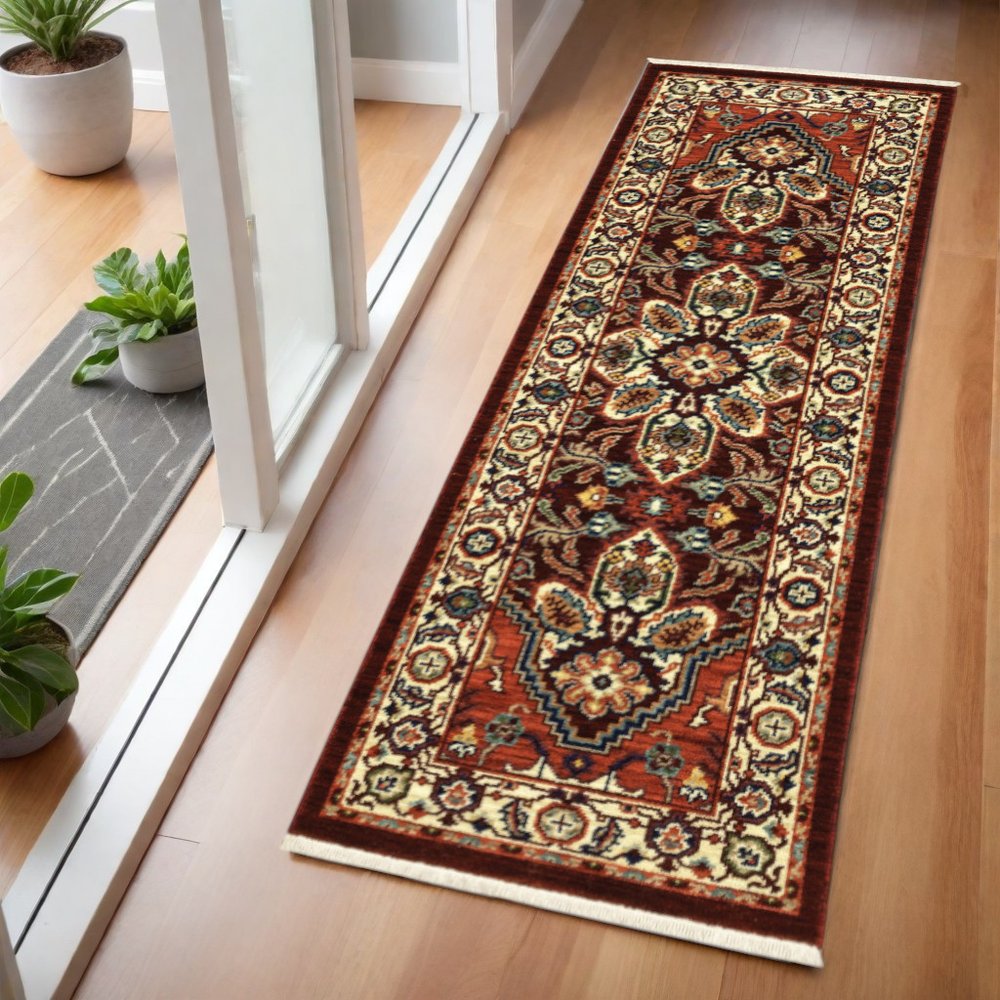 2' X 6' Red Ivory Orange And Blue Oriental Power Loom Stain Resistant Runner Rug With Fringe