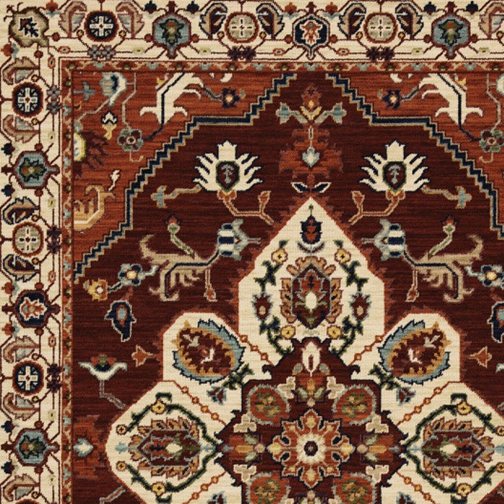 5' X 8' Red Ivory Orange And Blue Oriental Power Loom Stain Resistant Area Rug With Fringe