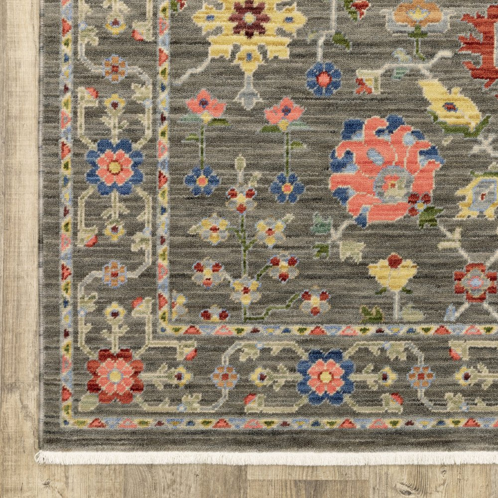 6' X 9' Grey Salmon Pink Gold Blue Rust Deep Blue Ivory And Green Oriental Power Loom Stain Resistant Area Rug With Fringe