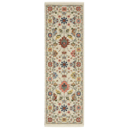 2' X 6' Ivory Salmon Pink Gold Blues Grey Rust And Green Oriental Power Loom Stain Resistant Runner Rug With Fringe