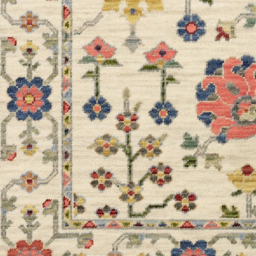 2' X 6' Ivory Salmon Pink Gold Blues Grey Rust And Green Oriental Power Loom Stain Resistant Runner Rug With Fringe